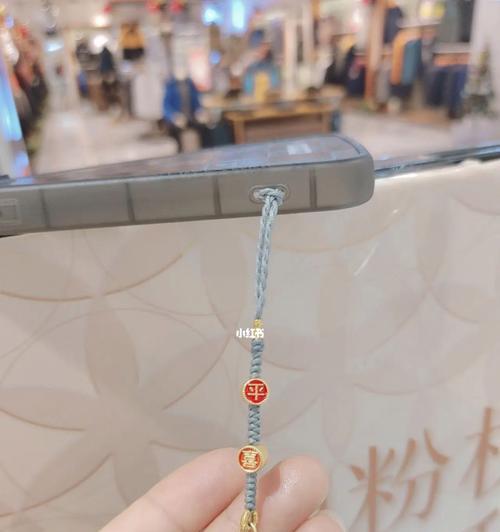 如何使用随身挂件相机进行手机拍照？